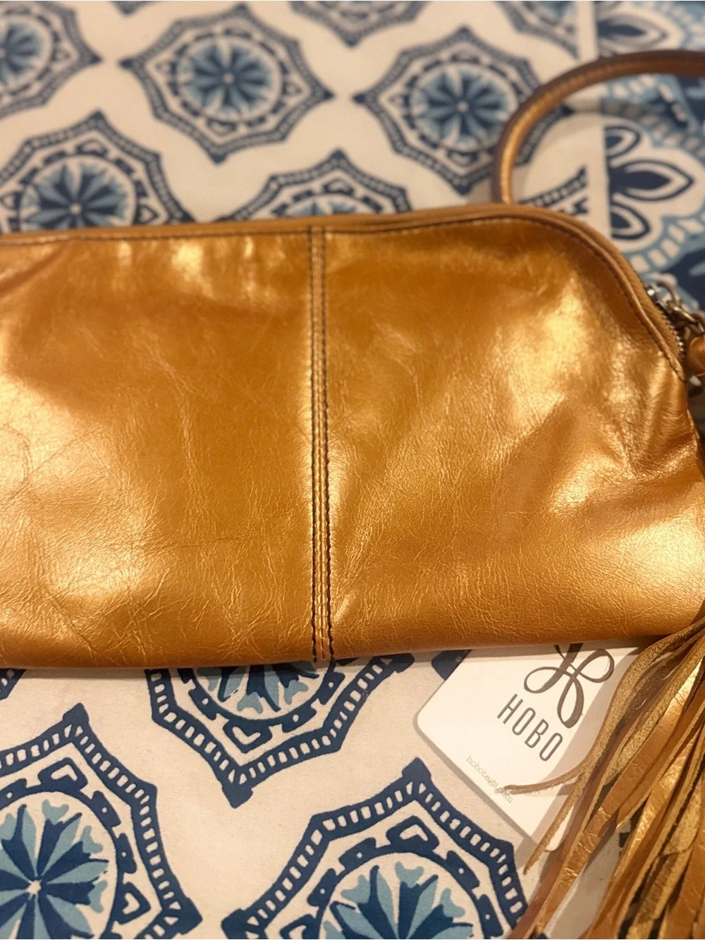 HOBO Metallic Gold Leather Wristlet with Tassel and Ring Handle
